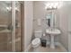 Small bathroom with pedestal sink and shower at 1030 Bellasol Way # 402, Apollo Beach, FL 33572