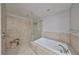 Spa-like bathroom with soaking tub and separate shower at 1030 Bellasol Way # 402, Apollo Beach, FL 33572