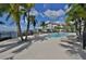 Resort-style pool and deck area with lounge chairs, overlooking the water at 1030 Bellasol Way # 402, Apollo Beach, FL 33572