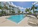 Inviting swimming pool with plenty of lounge chairs at 1030 Bellasol Way # 402, Apollo Beach, FL 33572