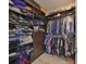 Large walk-in closet with ample shelving and hanging space at 1030 Bellasol Way # 402, Apollo Beach, FL 33572