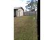 Simple backyard with grass and wooden fence at 10611 Fairfield Village Dr, Tampa, FL 33624