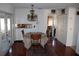 Cozy dining area featuring a chandelier and hardwood floors at 10611 Fairfield Village Dr, Tampa, FL 33624