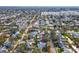 Wide aerial view of a suburban neighborhood, highlighting a single-Gathering home at 11123 Elmhurst Dr, Pinellas Park, FL 33782