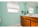 Bathroom with wood vanity and updated shower at 11453 Imperial Grove E Dr, Largo, FL 33774