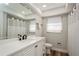 Modern bathroom with white vanity and new fixtures at 11453 Imperial Grove E Dr, Largo, FL 33774