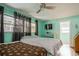 Bright bedroom with double bed and large windows at 11453 Imperial Grove E Dr, Largo, FL 33774