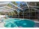 Inviting screened pool with patio furniture at 11453 Imperial Grove E Dr, Largo, FL 33774