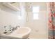 Clean bathroom with a shower/tub combo and tile at 11730 Gulf Blvd # 49, St Petersburg, FL 33706