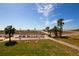 Relaxing beach view with shuffleboard courts and palm trees at 11730 Gulf Blvd # 49, St Petersburg, FL 33706