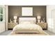 Cozy bedroom with a queen-size bed and elegant nightstands at 11866 Sparkling Topaz Cv, Parrish, FL 34219