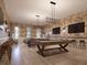 Relaxing game room with billiard tables and bar at 11866 Sparkling Topaz Cv, Parrish, FL 34219