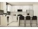 Modern kitchen with white cabinets, stainless steel appliances and an island at 12215 Radiant Gem Trl, Parrish, FL 34219