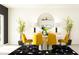 Elegant dining area featuring a round table and yellow chairs at 12227 Radiant Gem Trl, Parrish, FL 34219