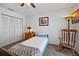 Bedroom with twin bed, rocking chair, and built-in closet at 12746 Wood Trail Blvd, Tampa, FL 33625