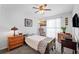 Small bedroom with twin bed and wood furniture at 12746 Wood Trail Blvd, Tampa, FL 33625