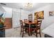 Bright dining area with wood table and chairs, near kitchen at 12746 Wood Trail Blvd, Tampa, FL 33625