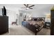 Spacious main bedroom with a large bed, ceiling fan, and ample closet space at 12746 Wood Trail Blvd, Tampa, FL 33625