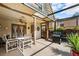 Screened patio with table and chairs, great for outdoor dining at 12746 Wood Trail Blvd, Tampa, FL 33625