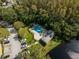 Community pool and clubhouse surrounded by lush trees at 12746 Wood Trail Blvd, Tampa, FL 33625