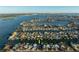 Aerial view of waterfront home with boat access at 129 Wall St, Redington Shores, FL 33708