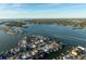 Wide aerial showcasing neighborhood and waterfront at 129 Wall St, Redington Shores, FL 33708