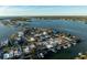 Aerial perspective of waterfront homes and canals at 129 Wall St, Redington Shores, FL 33708