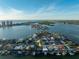 Aerial view of canal-front home and neighborhood at 129 Wall St, Redington Shores, FL 33708