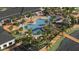 Aerial view of resort-style pool with lounge chairs and a boardwalk at 12968 Shining Blue Nile Ln, Parrish, FL 34219