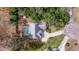 Home with pool and fenced backyard surrounded by lush trees at 1454 Brigadier Dr, Spring Hill, FL 34608