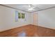 Cozy bedroom with wood flooring and a ceiling fan at 1454 Brigadier Dr, Spring Hill, FL 34608