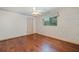 Simple bedroom with wood floors and a ceiling fan at 1454 Brigadier Dr, Spring Hill, FL 34608