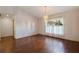 Bright dining room with hardwood floors and a large window at 1454 Brigadier Dr, Spring Hill, FL 34608