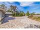 Large brick driveway with landscaping and a view of the house at 1454 Brigadier Dr, Spring Hill, FL 34608