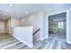 Bright hallway with hardwood floors leading to bedrooms at 14834 Paddock Pond Ave, Lithia, FL 33547