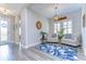 Cozy sitting area with light-colored sofas and a blue rug at 14834 Paddock Pond Ave, Lithia, FL 33547