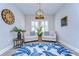 Bright sitting area with two armchairs, a rug, and wood floors at 14834 Paddock Pond Ave, Lithia, FL 33547