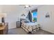 Cozy bedroom with a rustic feel and large window at 1712 Tahitian Sunrise Dr, Plant City, FL 33565