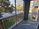 Screened balcony overlooking a tree-lined parking area at 18001 Richmond Place Dr # 721, Tampa, FL 33647