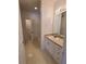 Bathroom with vanity, bathtub and access to hallway at 18001 Richmond Place Dr # 721, Tampa, FL 33647