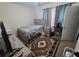 Bright bedroom with a double bed and patterned rug at 18001 Richmond Place Dr # 721, Tampa, FL 33647