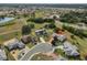 Aerial view showcasing home's location in a residential neighborhood at 1807 Pineapple Palm Ct, Sun City Center, FL 33573