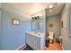 Clean bathroom with a single vanity, shower, and toilet at 1807 Pineapple Palm Ct, Sun City Center, FL 33573