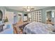 Bright bedroom with a queen-size bed and access to bathroom at 1807 Pineapple Palm Ct, Sun City Center, FL 33573