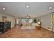 Spacious living room featuring tile floors, comfy sofas, and a ceiling fan at 1807 Pineapple Palm Ct, Sun City Center, FL 33573