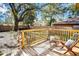 Deck with seating area overlooking a fenced backyard at 1913 E Wilder Ave, Tampa, FL 33610