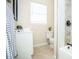 Clean bathroom with a white vanity, toilet, and tile floors at 1913 E Wilder Ave, Tampa, FL 33610