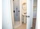 Modern bathroom with pedestal sink and walk-in shower at 1913 E Wilder Ave, Tampa, FL 33610