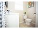 Stylish bathroom with a toilet, vanity, and tile flooring at 1913 E Wilder Ave, Tampa, FL 33610