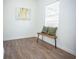 Simple bedroom with wood bench and large window at 1913 E Wilder Ave, Tampa, FL 33610